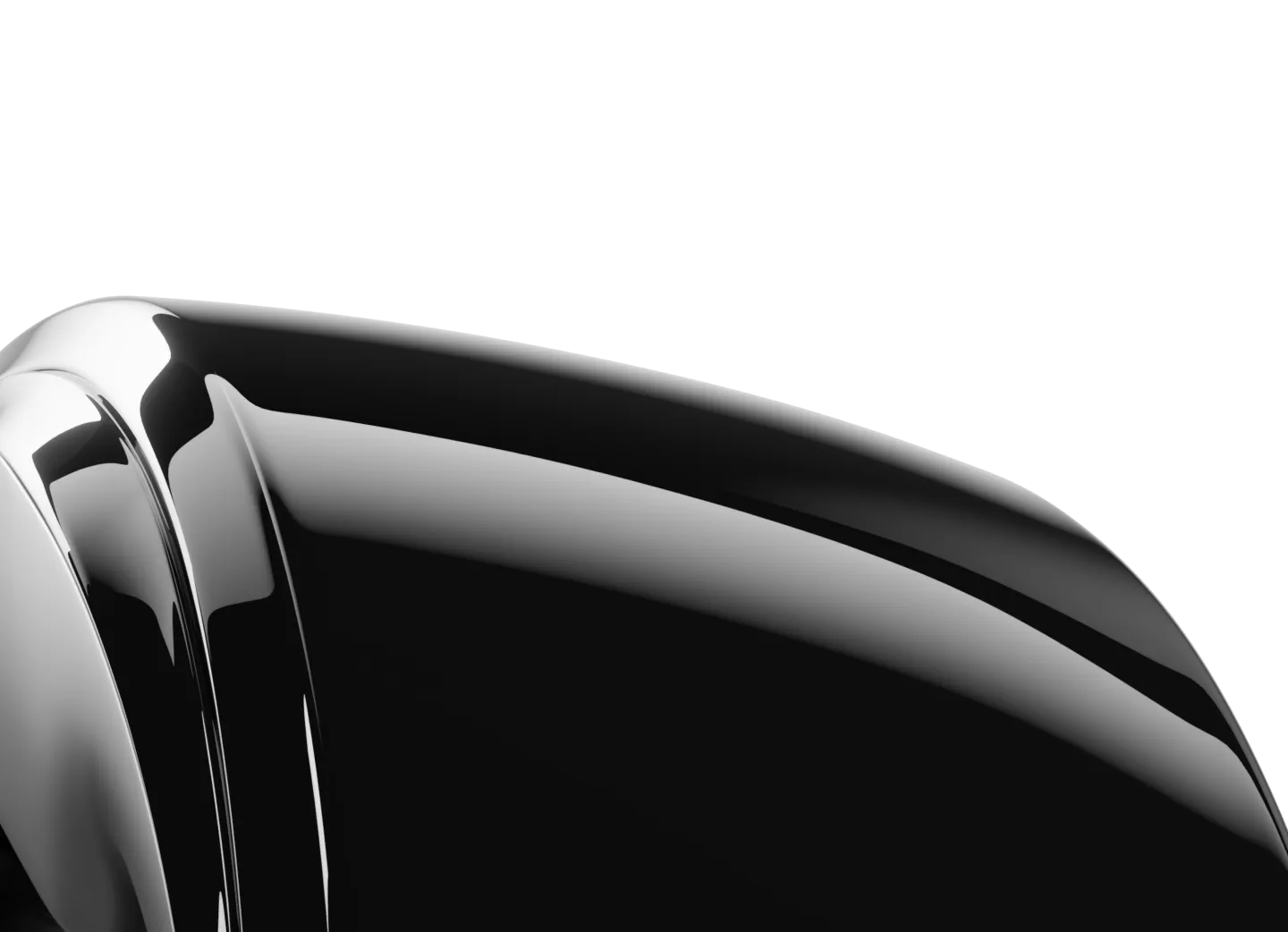 Close-up of a shiny, black ring surface with smooth, curved edges, reflecting light. The surface appears polished and glossy.